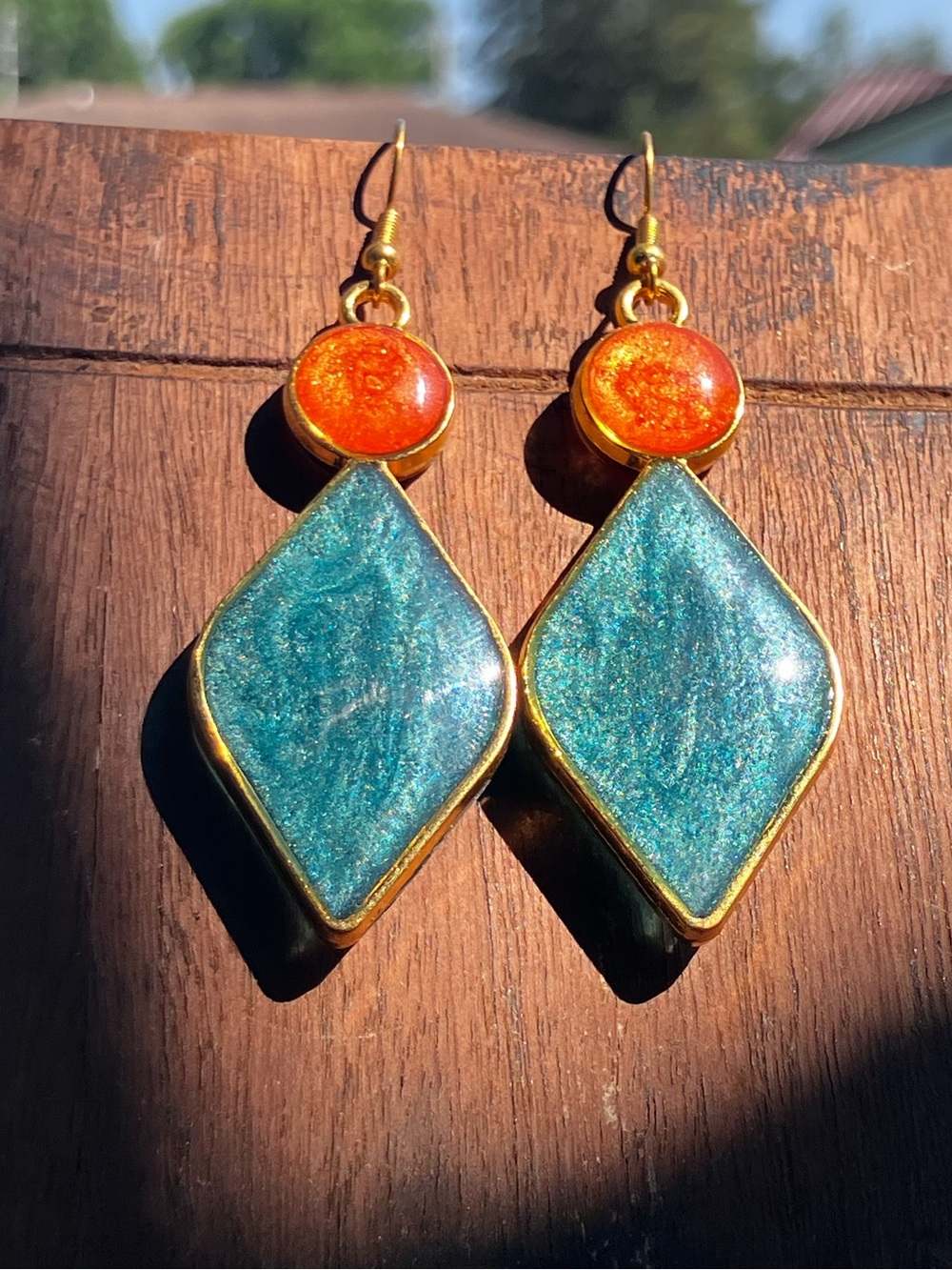 Teal and burnt orange geometric dangle earrings